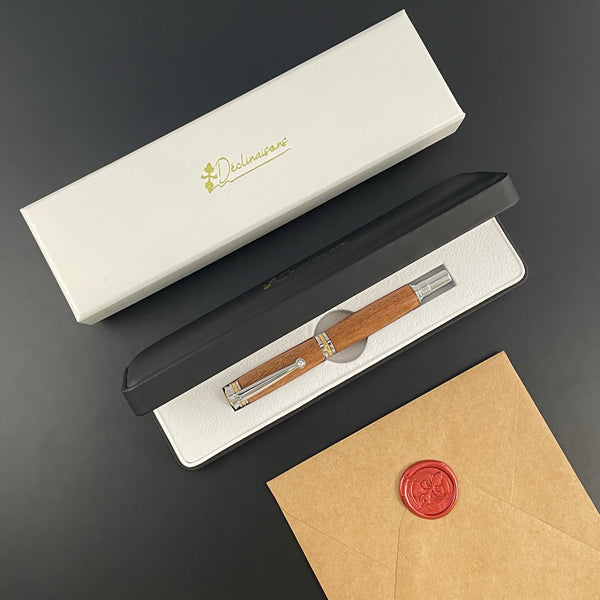 Stylo Roller Luxe Acajou d'Afrique avec éléments plaqué Or 24k et Cristal. Personnalisable et livré avec boîte cadeau luxe.