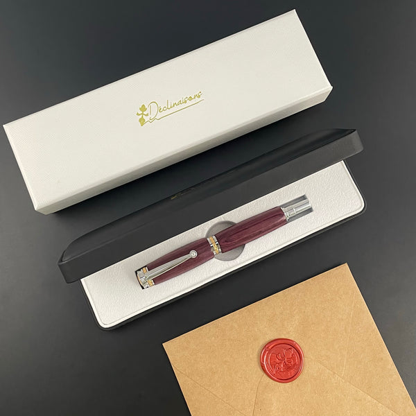 Stylo Roller Luxe Bois Amarante avec éléments plaqué Or 24k et Cristal. Personnalisable et livré avec boîte cadeau luxe.