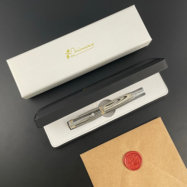 Stylo Roller Luxe Bois Ebene Macassar Blanc et Noir avec éléments plaqué Or 24k et Cristal. Personnalisable et livré avec boîte cadeau luxe.