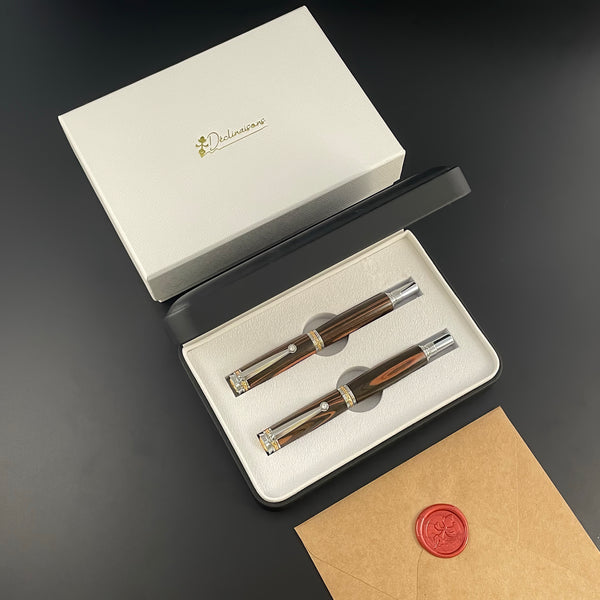 Parure 2 Stylos Luxe Bois Ebène Noir de Macassar, avec éléments plaqué Or 24k et Cristal. Personnalisé et livré avec boîte cadeau luxe.