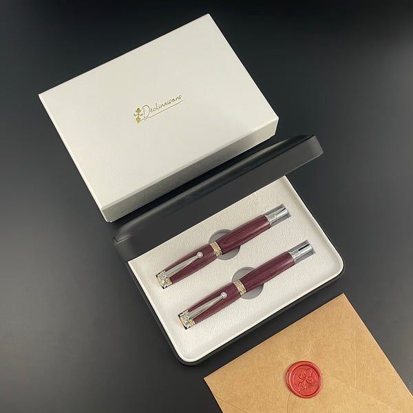 Parure 2 Stylos Luxe Bois Amarante, avec éléments plaqué Or 24k et Cristal. Personnalisé et livré avec boîte cadeau luxe.