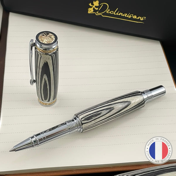 Stylo Roller Luxe Bois Ebene Macassar Blanc et Noir avec éléments plaqué Or 24k et Cristal. Personnalisable et livré avec boîte cadeau luxe.