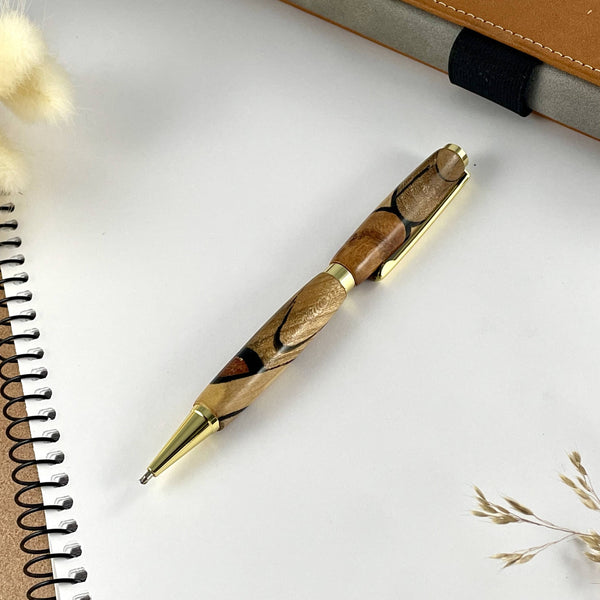 Stylo or en bois précieux et résine noire. Stylos Déclinaisons